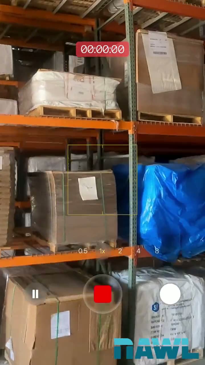 NAWL warehouse with green upright frames and orange teardrop pallet rack beams