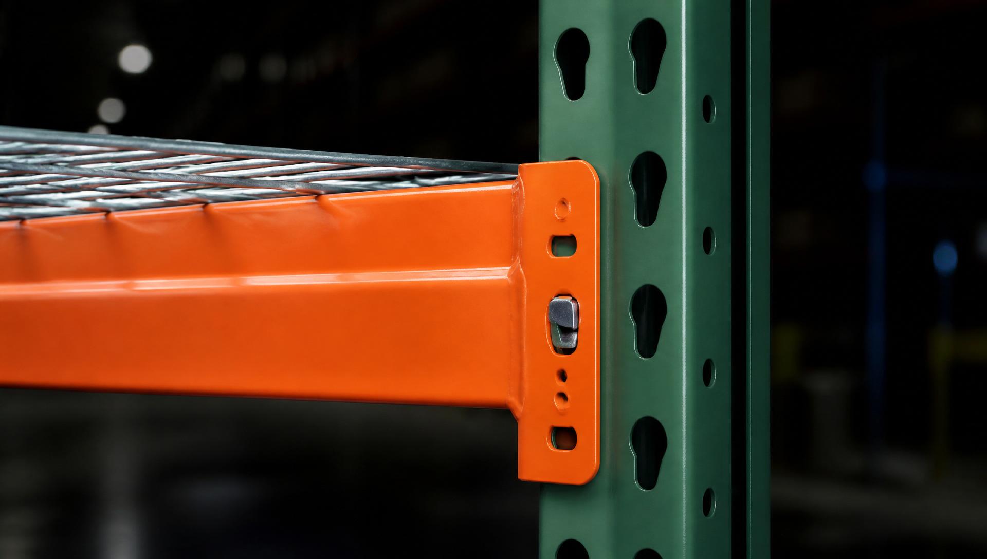 NAWL warehouse with green upright frames and orange teardrop pallet rack beams